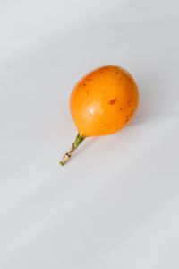 Fresh Passion Fruit on White Marble for Healthy Food Styling and Editorial Use