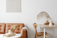 Kaboompics - Scandinavian Living Room Workspace with Leather Sofa, Wood Desk and Neutral Decor
