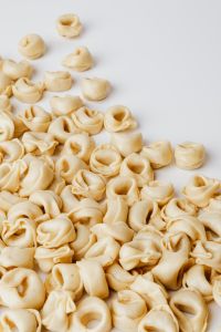 Kaboompics - Overhead Tortellini Scatter for Italian Recipe Styling and Menu Design
