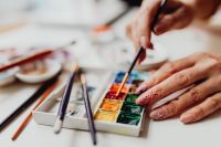 Kaboompics - A woman paints with watercolors