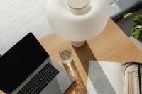 Kaboompics - Sunlit Work From Home Flat Lay with Laptop and Reading Magazine