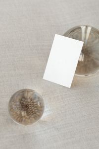 Kaboompics - Overhead Card Mockup with Glass Spheres on Beige Fabric