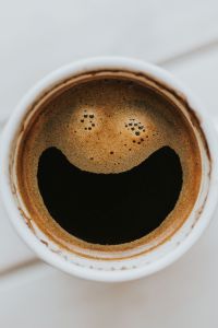 Coffee on a table with other items