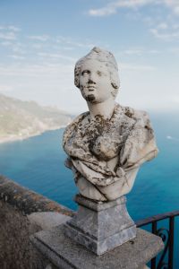Kaboompics - Weathered Marble Bust Framed by Amalfi Coast and Sea