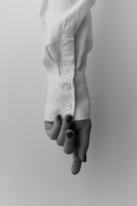 Kaboompics - Relaxed Hand and Oversized White Shirt Sleeve
