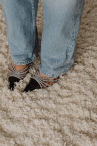 Kaboompics - Black Embellished High Heels with Jeans on a Shag Rug