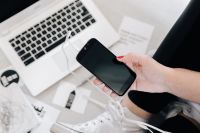 Kaboompics - Female hand with black mobile phone