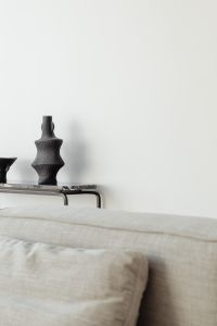 Kaboompics - Black Ceramic Vase And Bowl On Marble Console Behind Sofa