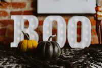 Kaboompics - Black Pumpkin in Front of Illuminated BOO Letters