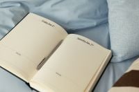 Kaboompics - Open Journal and Pen on Cozy Blue Bed