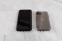 Kaboompics - Two Smartphones Placed Apart on White Ribbed Marble with Generous Copy Space