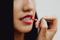 Kaboompics - Applying Red Liquid Lipstick with Wand in Asian Beauty Makeup Close-Up