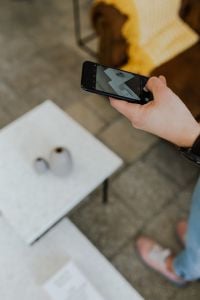 Kaboompics - Portrait Crop of Hand Using Smartphone with Wristwatch