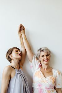 Kaboompics - Lesbian Couple Celebrating Pride with Painted Rainbow Arms