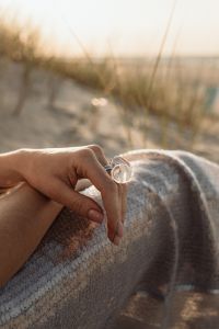 Kaboompics - Close Up of Statement Ring on Sequin Skirt in Dunes