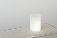 Kaboompics - Wide Candle Jar Mockup on Textured Sofa with Copy Space