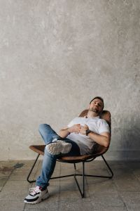 Kaboompics - The man is sitting in a chair and relaxing