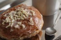 Kaboompics - Glazed Pastry with White Shavings and Coffee Close-Up