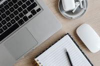 Kaboompics - Laptop, AirPods, Mouse and Notebook with Pen on Desk