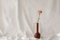 Kaboompics - Delicate Flower Arrangement on Draped White Fabric