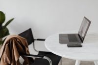 Kaboompics - MacBook Pro 15 laptop and iPhone 11 Pro on a marble table