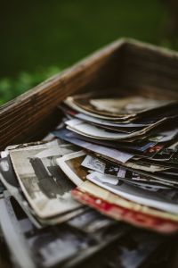 Kaboompics - Vertical Close-Up of Vintage Pictures in a Wooden Box
