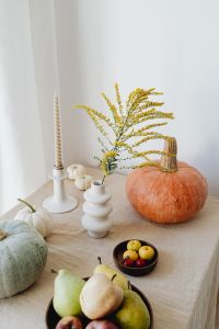 Kaboompics - Autumn Still Life with Orange and Pale Green Pumpkins, Goldenrod, Candle and Fruit Bowl