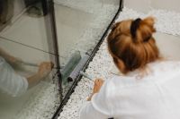 Kaboompics - Woman Wiping the Floor Beside a Glass Window