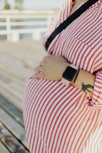 Maternity Lifestyle with Pregnant Woman Wearing a Smartwatch