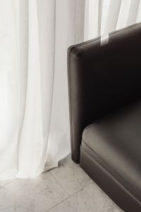 Kaboompics - Black Leather Armchair in a Sunlit Minimalist Room