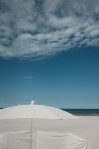 Kaboompics - White Beach Umbrella Against Blue Sky and Sea