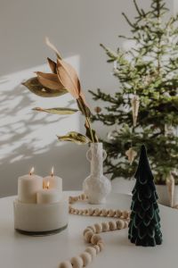 Kaboompics - Minimal Christmas Table with Candles and Green Paper Tree