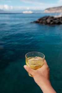 Kaboompics - Cropped Cocktail Glass beside a Soft-Focus Rocky Coast