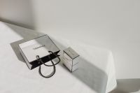 Kaboompics - Chanel Shopping Bag and Small Chanel Box on White Fabric with Hard Light