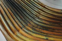 Kaboompics - Oxidized Curved Metal Elements in a Repeating Industrial Texture