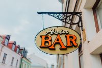 Kaboompics - Vintage Bar Sign on a Colorful Town Street