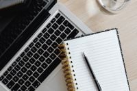 Kaboompics - Close-Up of Laptop Keyboard, Notebook and Glass of Water