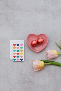 Kaboompics - Valentine Flatlay With Heart Card, Foil Chocolates, and Tulips