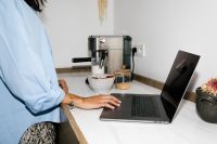 Kaboompics - Flash Photography Aesthetic of Laptop and Espresso Machine in Modern Kitchen