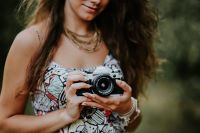 Kaboompics - Woman in a dress with a camera
