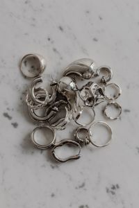 Kaboompics - Silver Rings and Jewelry on Neutral Surface