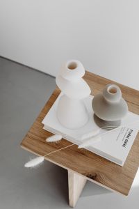 Kaboompics - Overhead Still Life of Ceramic Vases, Book and Dried Seed Stems