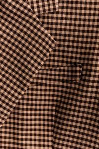 Kaboompics - Brown Gingham Fabric – Blazer Drape and Pocket Close-Up