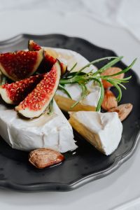 Kaboompics - Camembert Cut into Wedges with Figs, Rosemary and Almonds