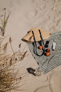 Kaboompics - Straw Bag, Towel, Peaches, Sunglasses and Water Bottle