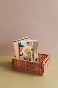 Kaboompics - Pastel Stationery Basket on Two-Tone Surface