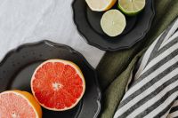 Kaboompics - Red Grapefruit Slices beside Lemon and Lime on White Linen, Overhead Citrus Still Life