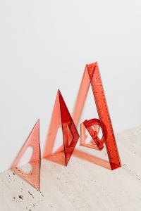 Kaboompics - Red Transparent Geometry Rulers and Protractor on White for Math Worksheets and Classroom Use
