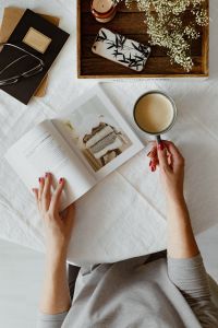 Kaboompics - Woman read book and drink coffee