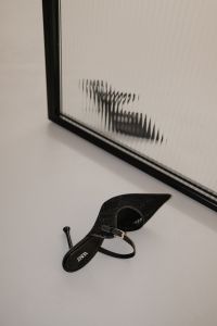Kaboompics - Black Woven Slingback Heel by Ribbed Glass Wall